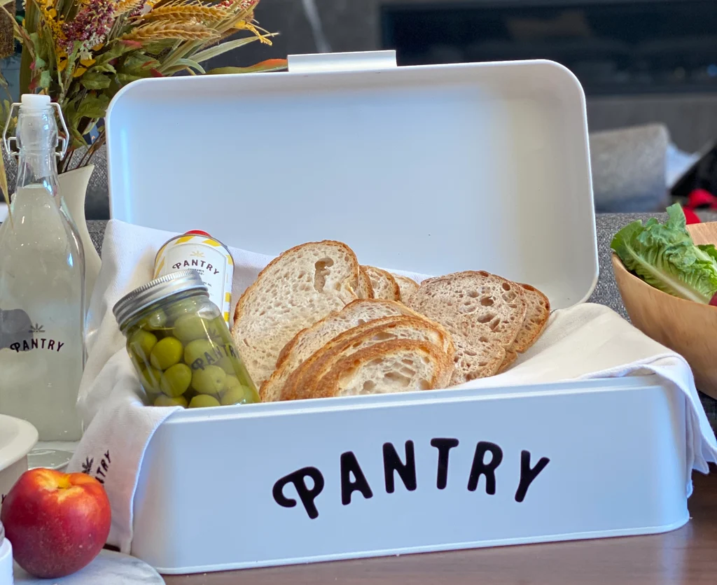 Pantry Bread Basket with Olives Marinating in Jar